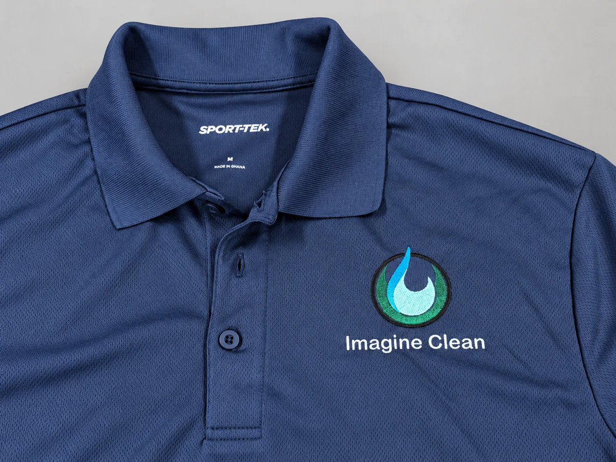 Imagine Clean logo embroidered on a navy work polo