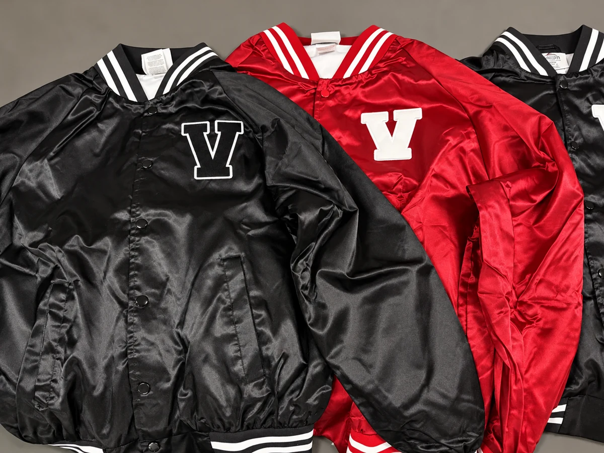 Black and red varsity jackets with embroidered V lettering